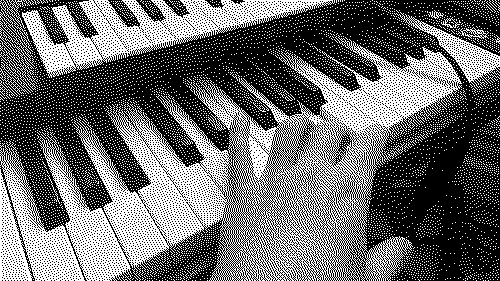 Hand on the piano.